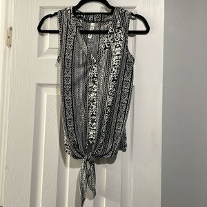 Black and white tank top with buttons and tie